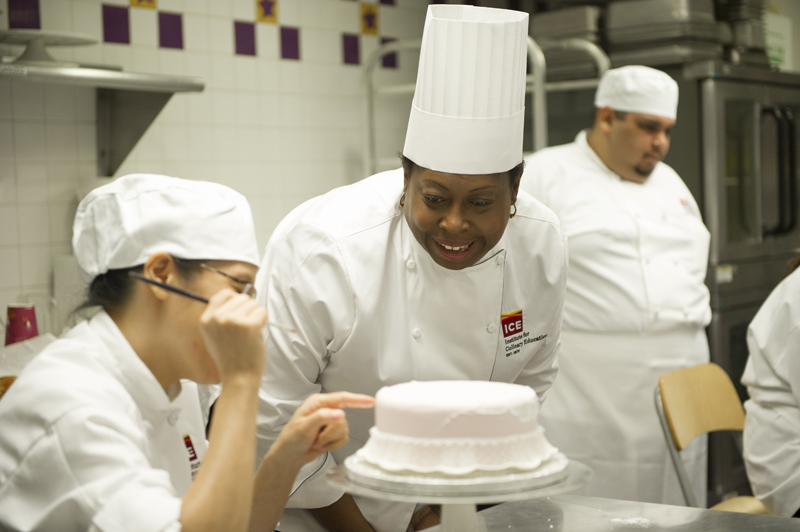 Pastry chef Toba Garrett teaching a cake decorating class in New York