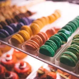 Macarons in a display case at a specialty pastry shop