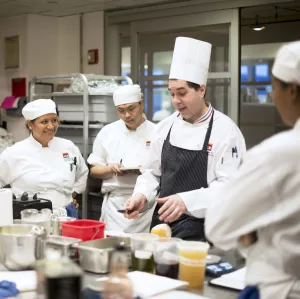chef instructor giving a lesson at the institute of culinary education