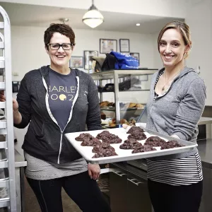 Levain Bakery cofounders Pam Weekes and Connie McDonald with their famous cookies.