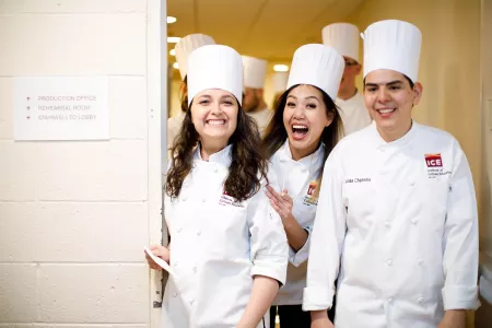 Students celebrate their graduation ceremony from the Institute of Culinary Education
