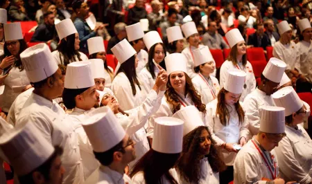 A student takes a selfie at the Institute of Culinary Education 2017 commencement ceremony