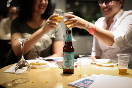 Guests toast with Brooklyn beer