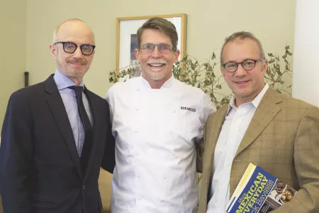 ICE Dean of Business Management Steve Zagor and ICE President Rick Smilow pose for a photo with chef Rick Bayless