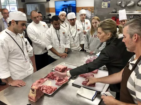 Debra Rocker shares meat purveyor tips with students.
