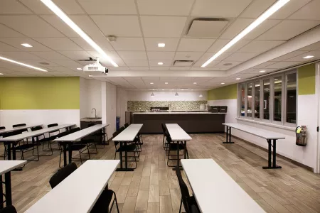 The mixology center has a tiled bar and classroom space