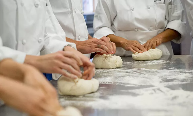 Artisan Bread Baking students receiving culinary training in New York at the Institute of Culinary Education.