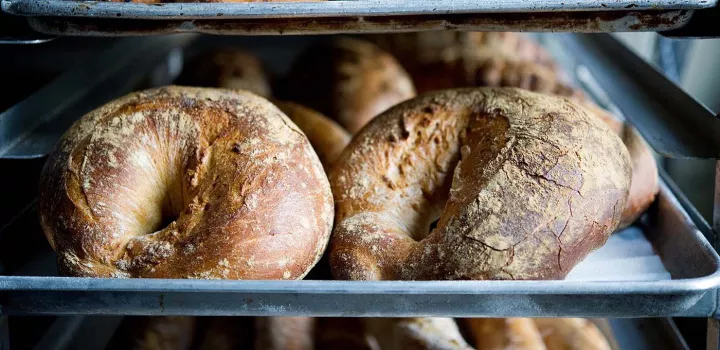 Beautiful loaves of bread on a rack with natural light