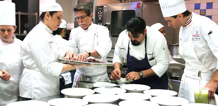 chef rick bayless preparing octopus in the ICE kitchens