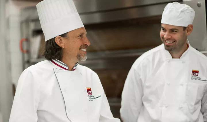 Chef Sim Cass, Dean of Professional Bread Baking at ICE, smiles back at an ICE student