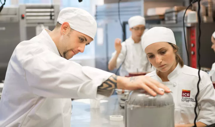 Students prepare cookies in pastry school at the Institute of Culinary Education