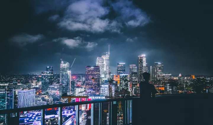 The Los Angeles Skyline at night, photo by Andre Benz via Unsplash