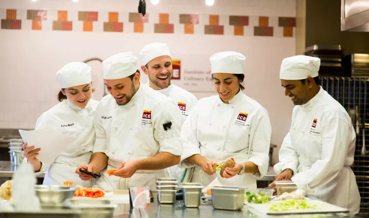 ICE culinary students work together in a kitchen classroom