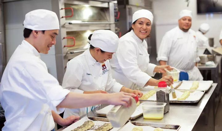 Pastry school students prepare breads in class at the Institute of Culinary Education